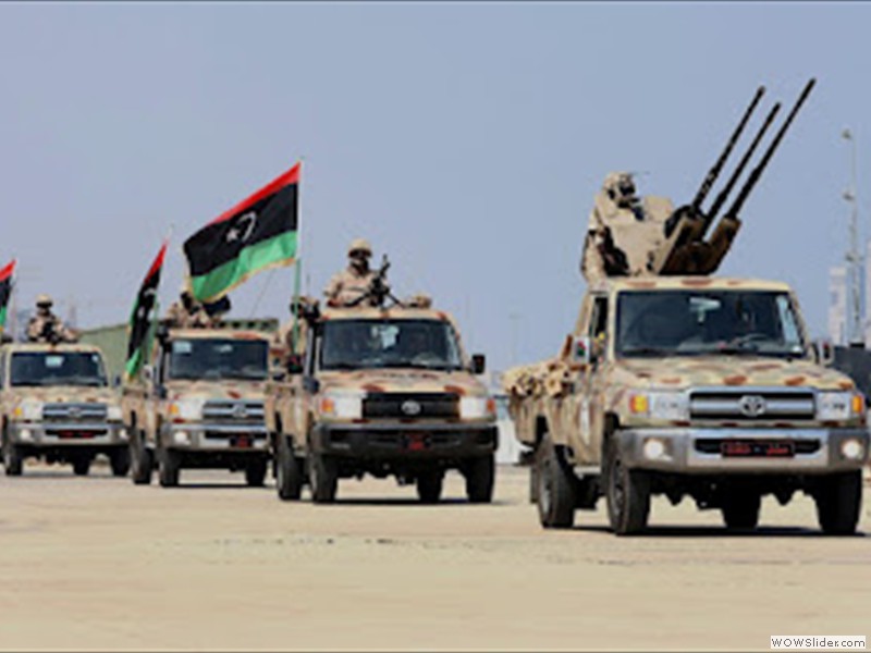 Soldiers of the Libyan National Army parade with their military pick-up vehicles during the graduation ceremony of new batch of the Libyan Navy special forces the Mediterranean sea port of Tripo (1)
